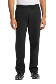 Person wearing black pants on a white background