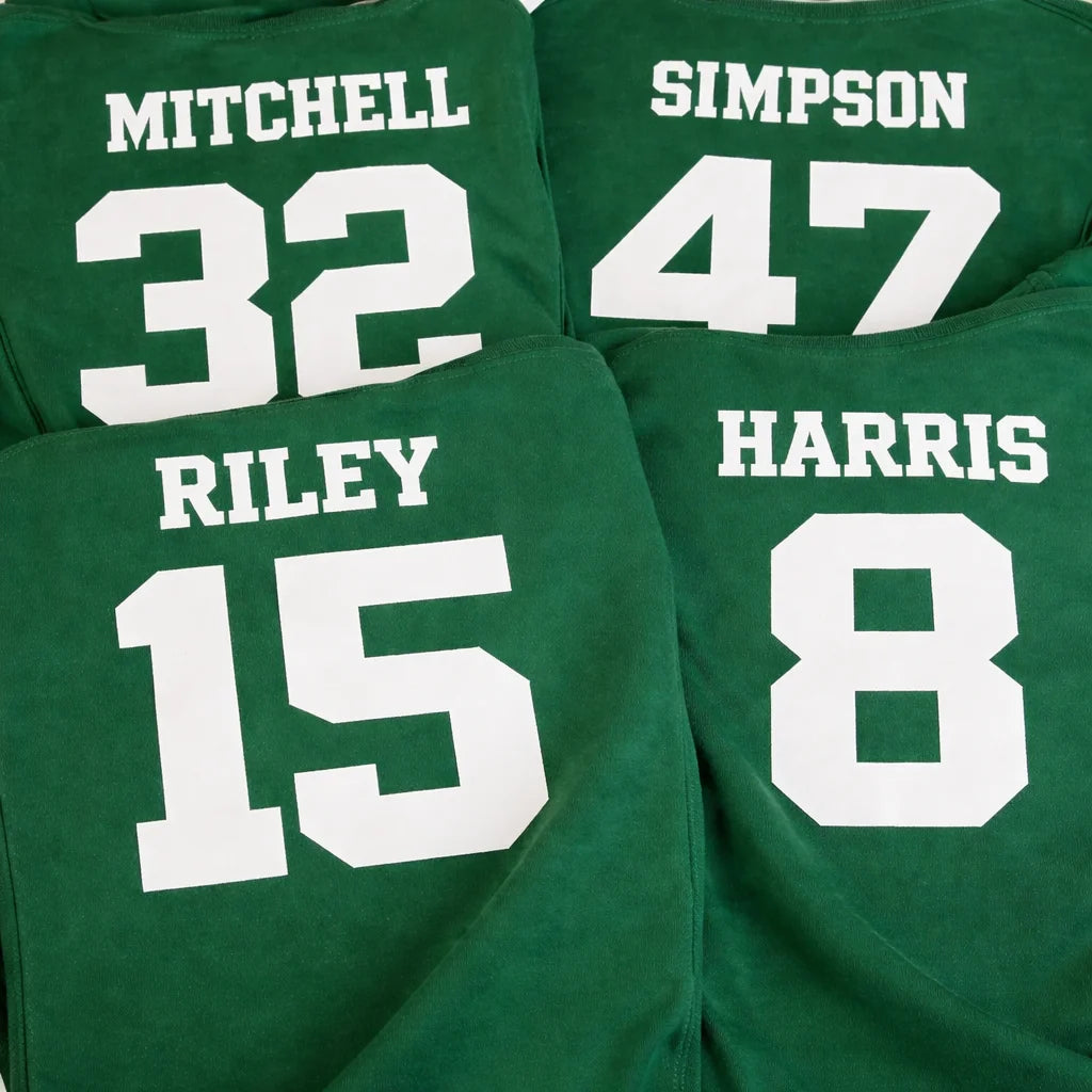 Green shirts with names and numbers printed on them