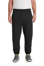 Person wearing black sweatpants on a white background
