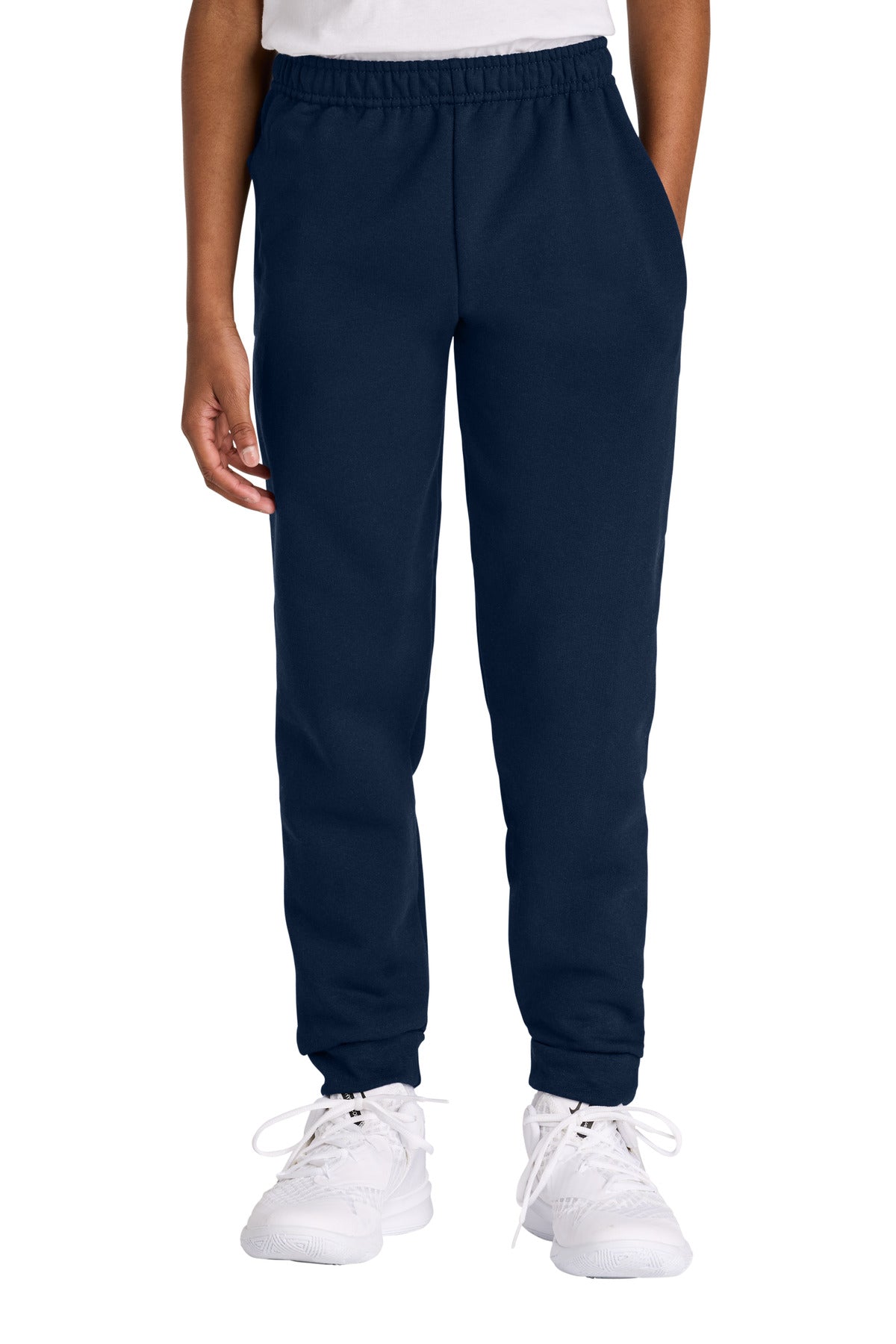 Navy blue jogger pants worn by a person on a white background