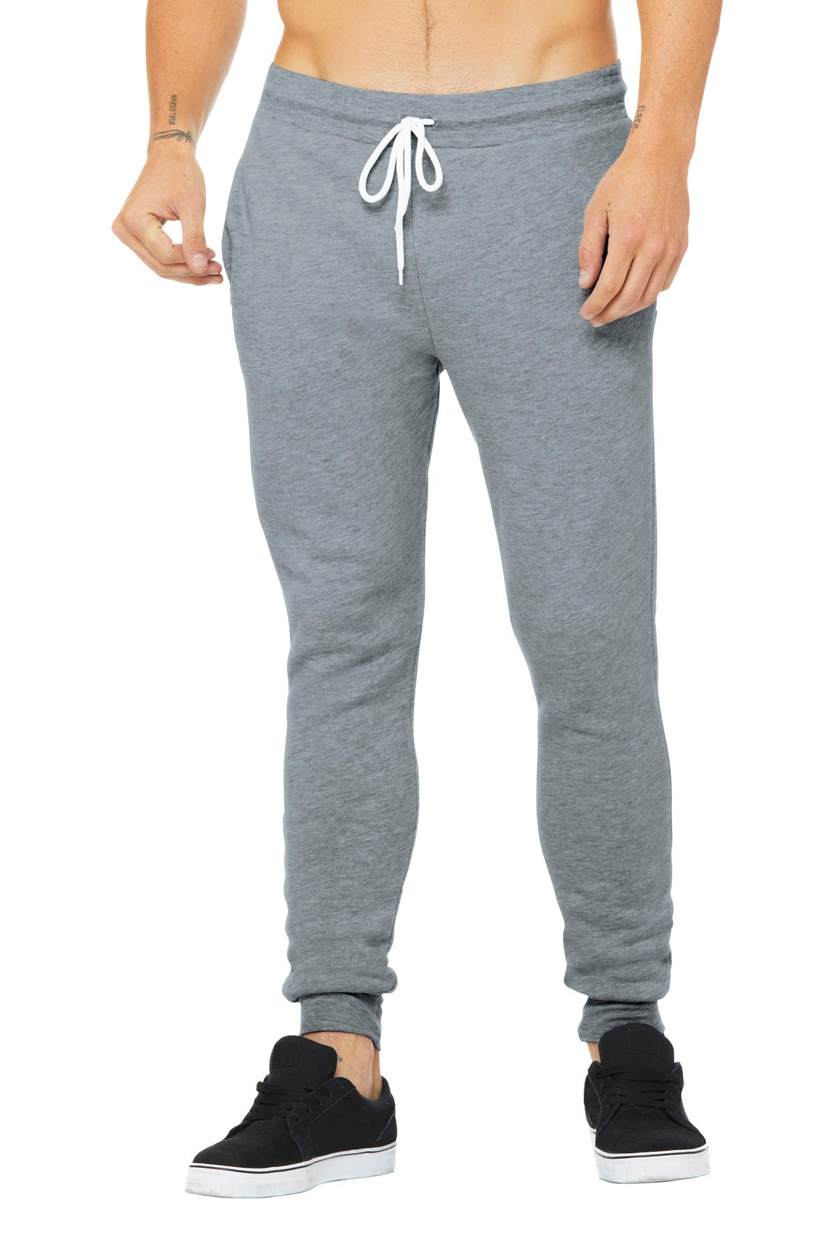 Gray sweatpants worn by a person on a white background