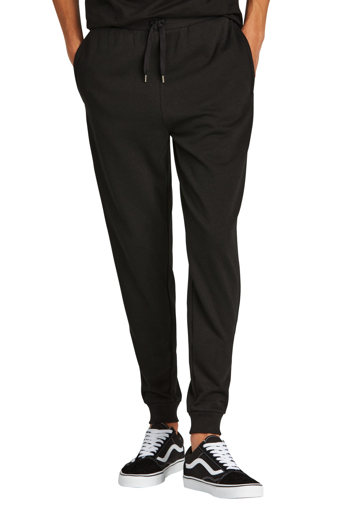 Black jogger pants worn by a person on a white background