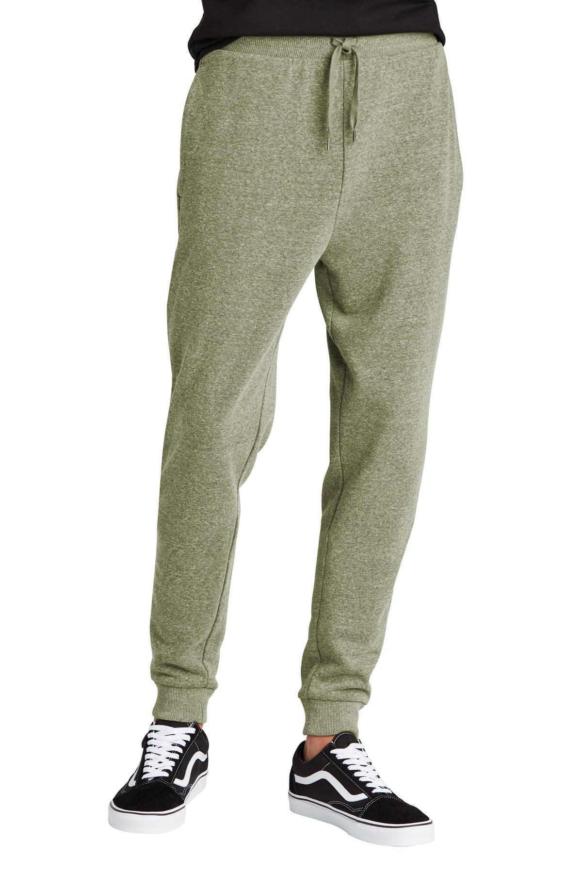 Green sweatpants worn by a person on a white background