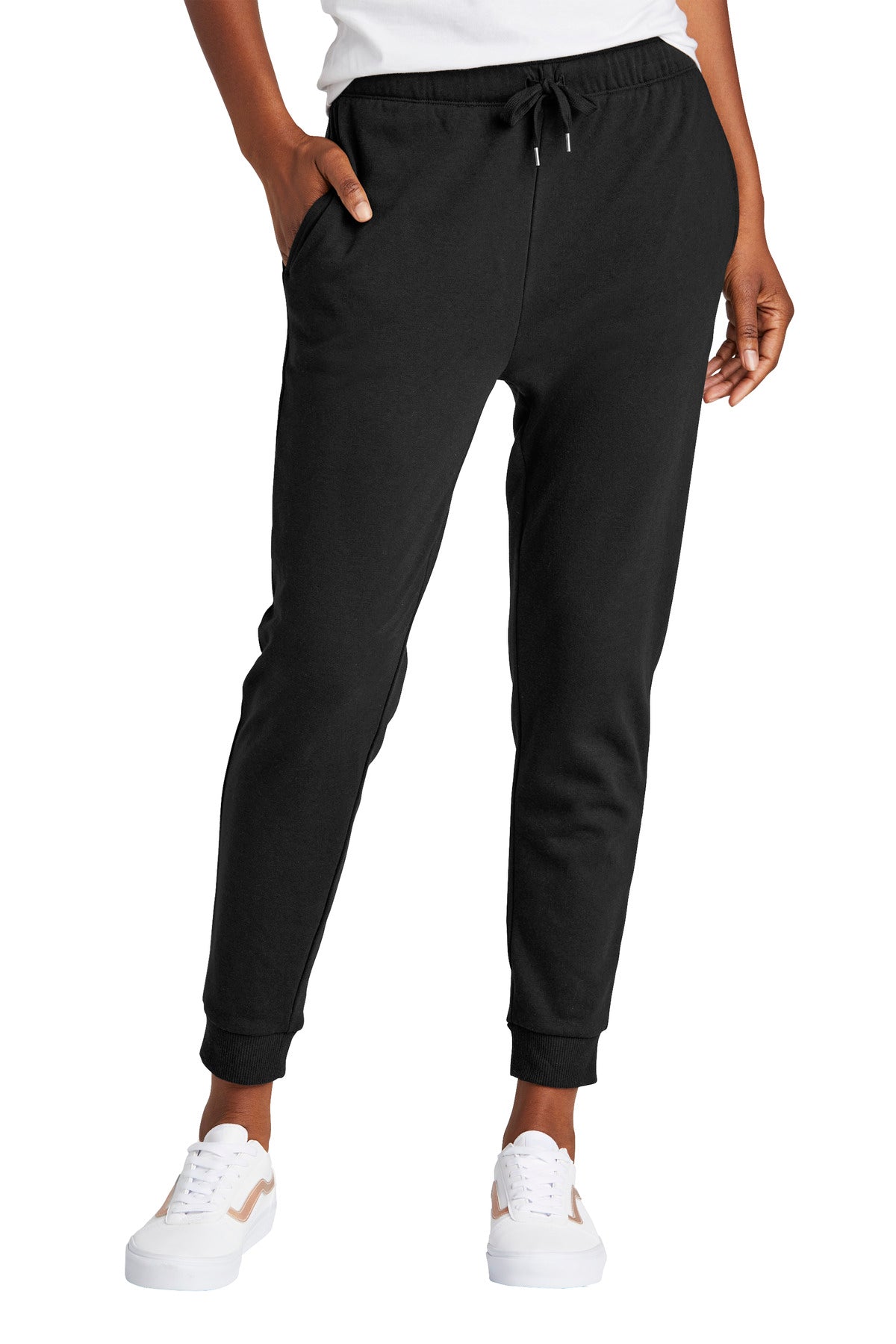 Black jogger pants worn by a person on a white background