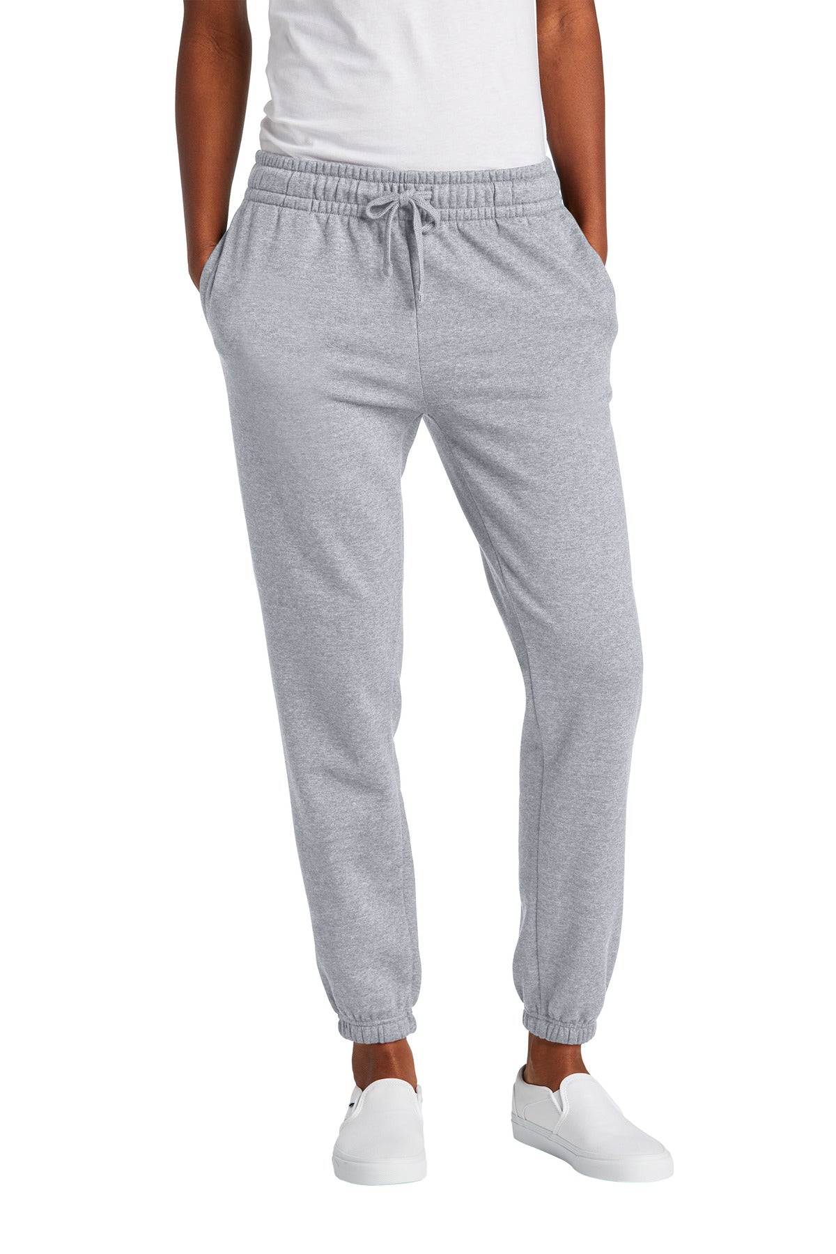 Gray sweatpants worn by a person on a white background