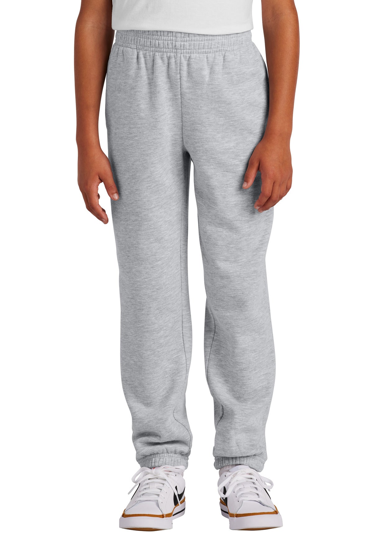 Person wearing gray sweatpants on a white background