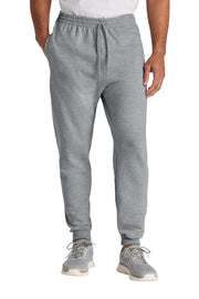 Person wearing gray jogger pants on a white background