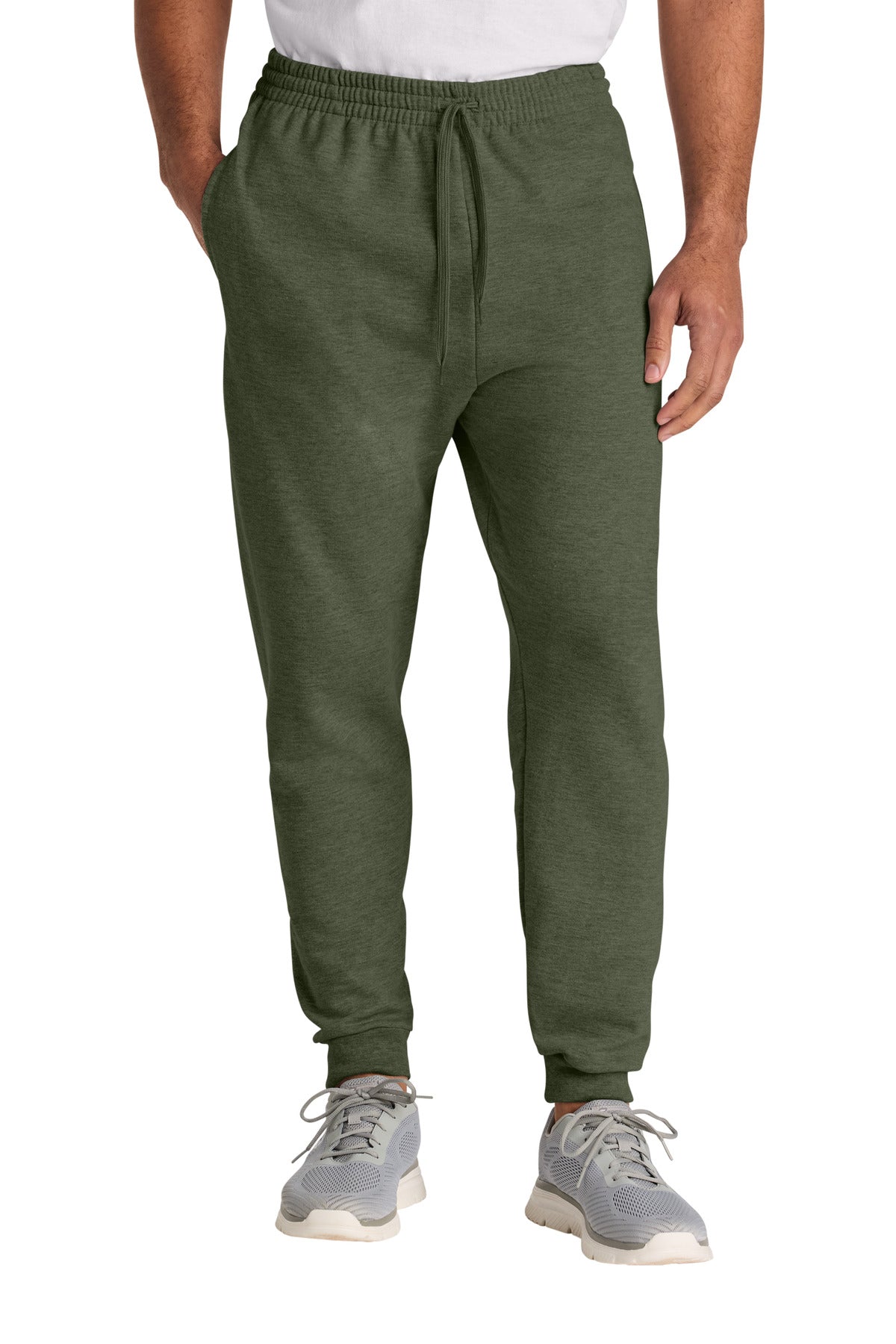 Person wearing green sweatpants on a white background