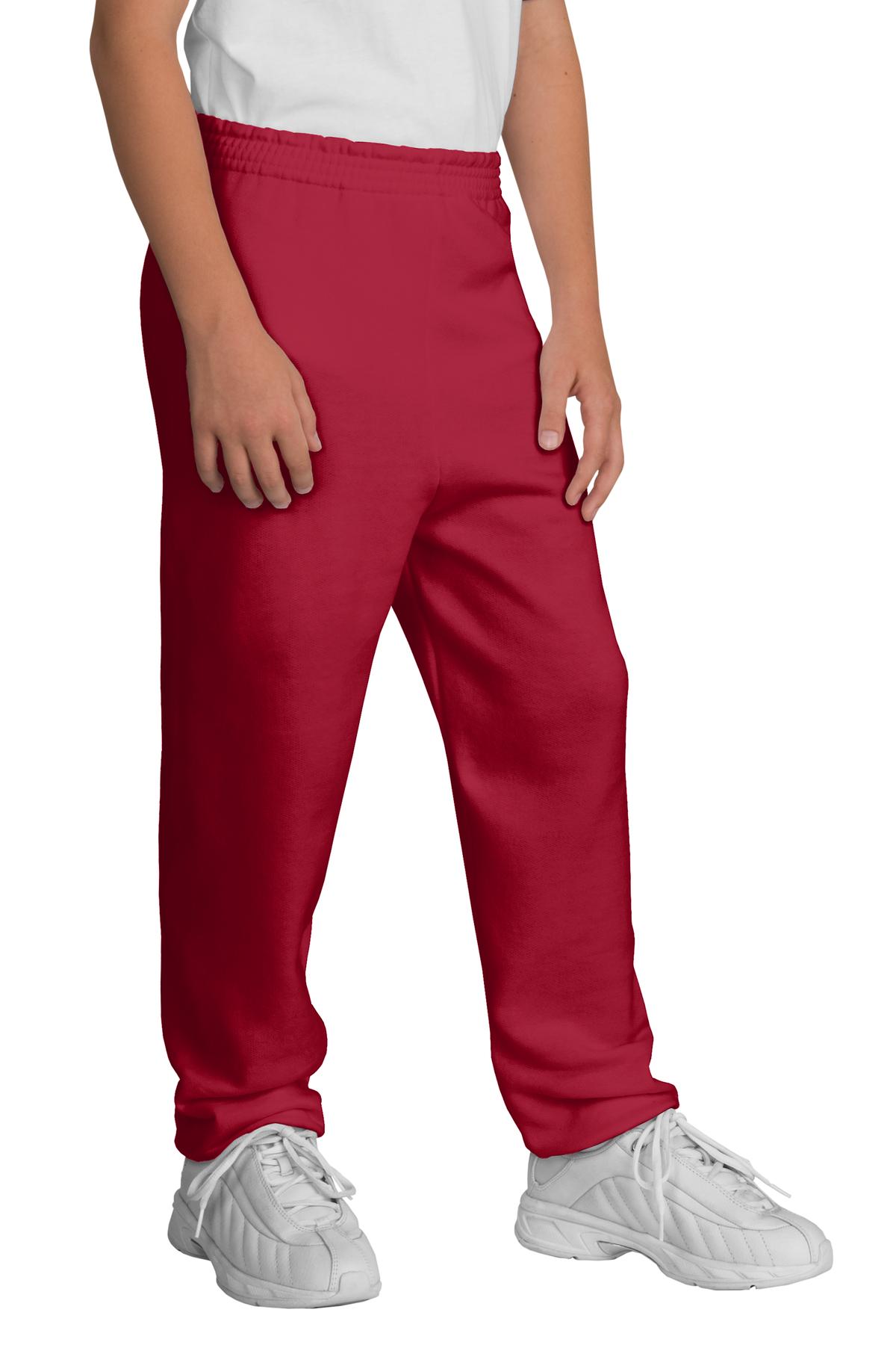 Red pants worn by a person on a white background