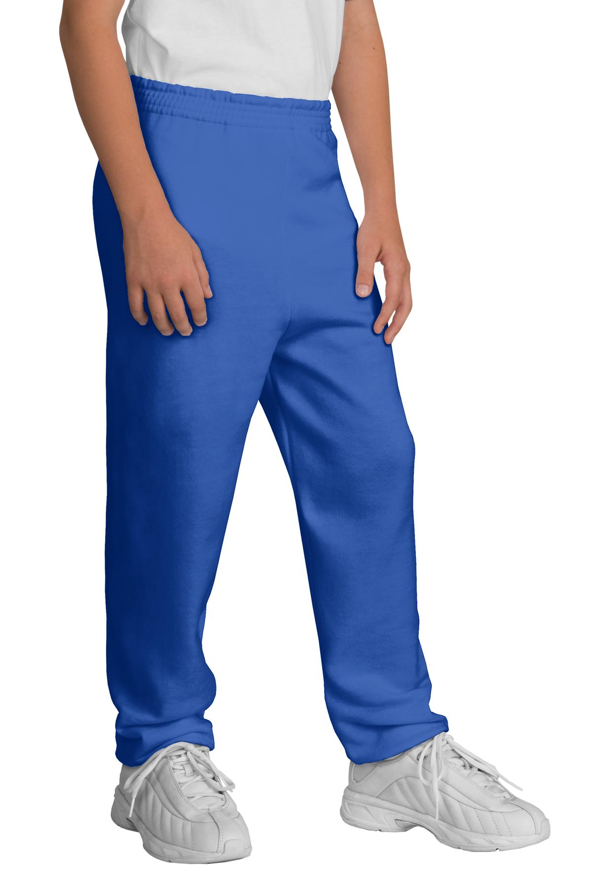 Person wearing blue pants and white shoes on a white background