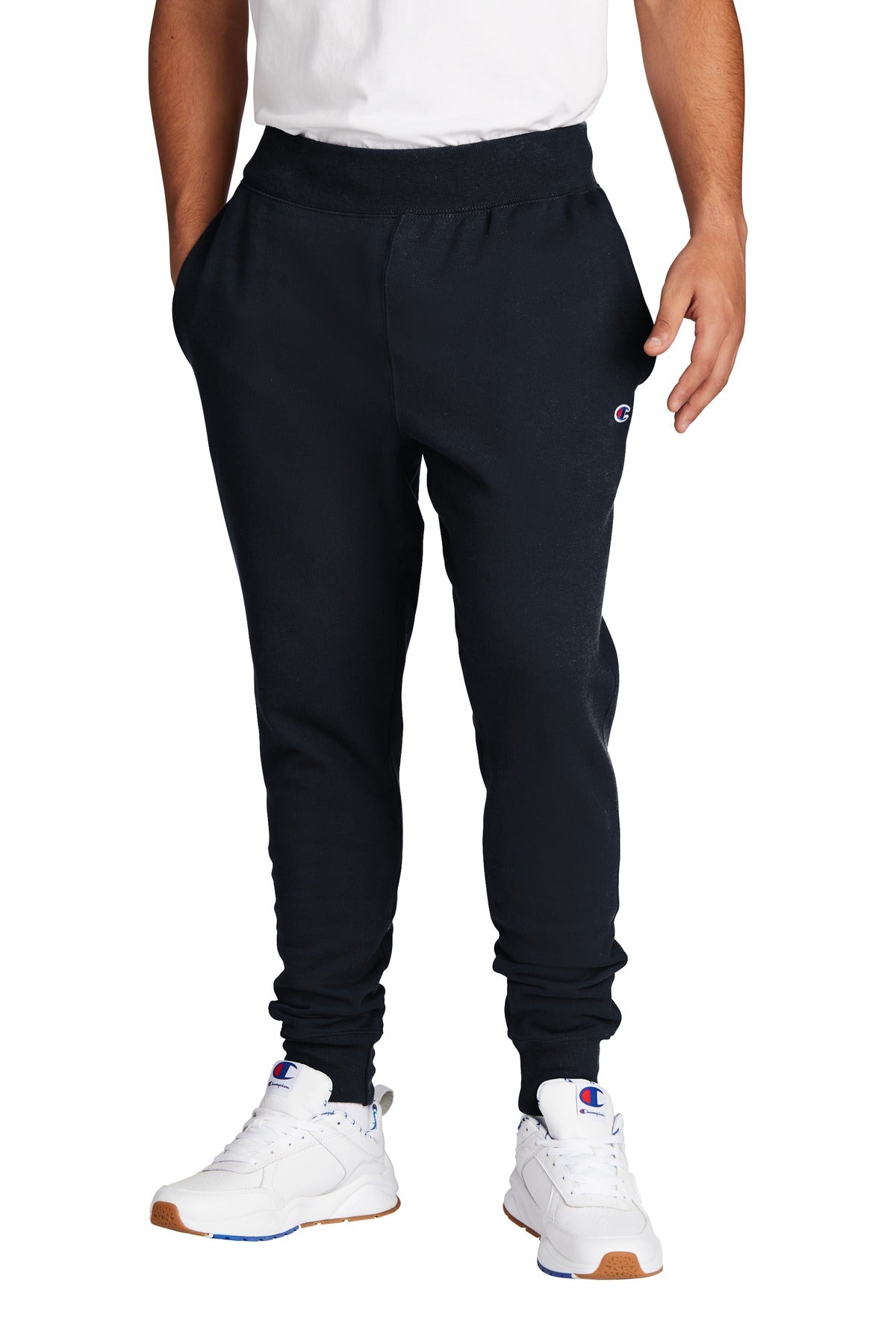 Person wearing black Champion sweatpants on a white background