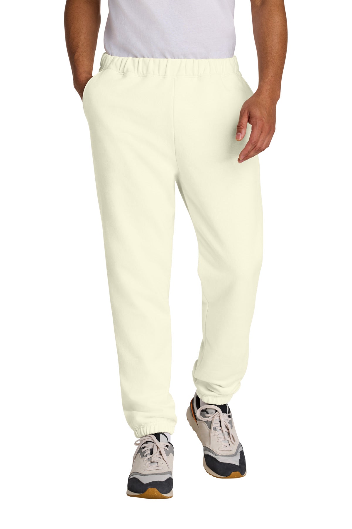 Person wearing light-colored jogger pants on a white background