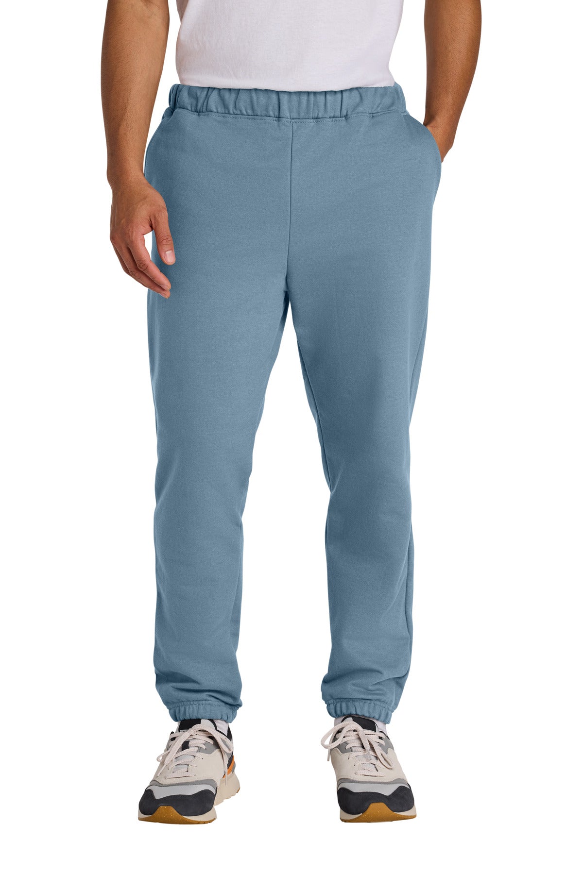 Person wearing blue sweatpants on a white background