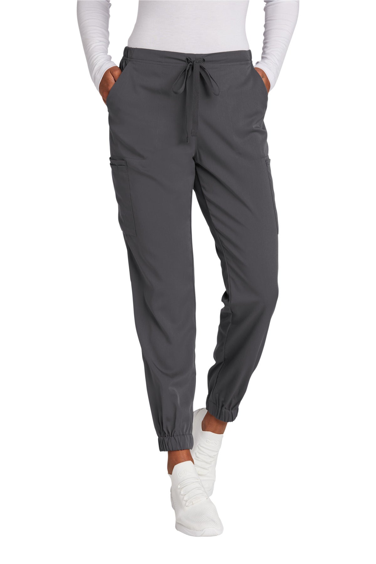 Pink jogger pants worn by a person on a white background