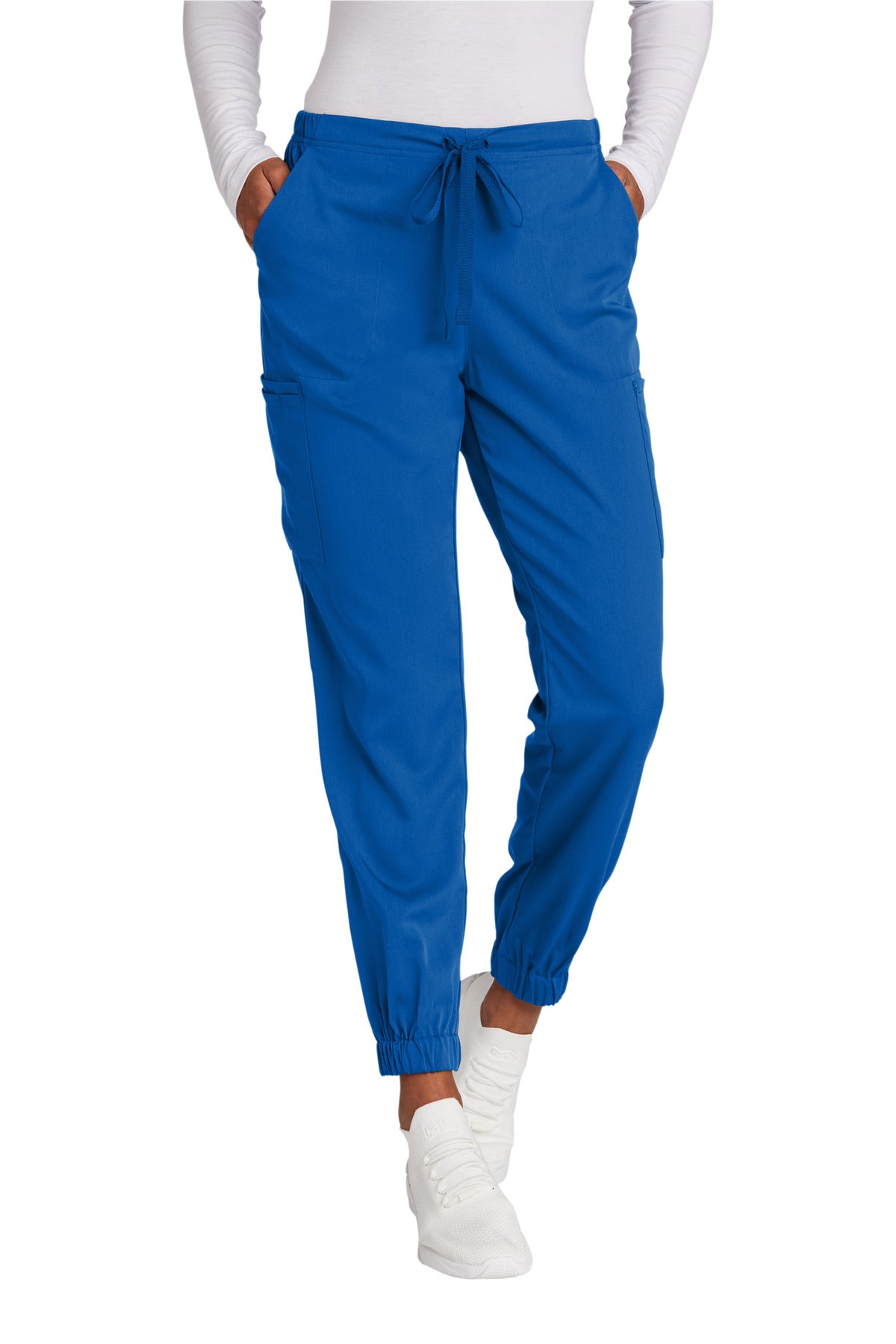 Blue pants worn by a person on a white background