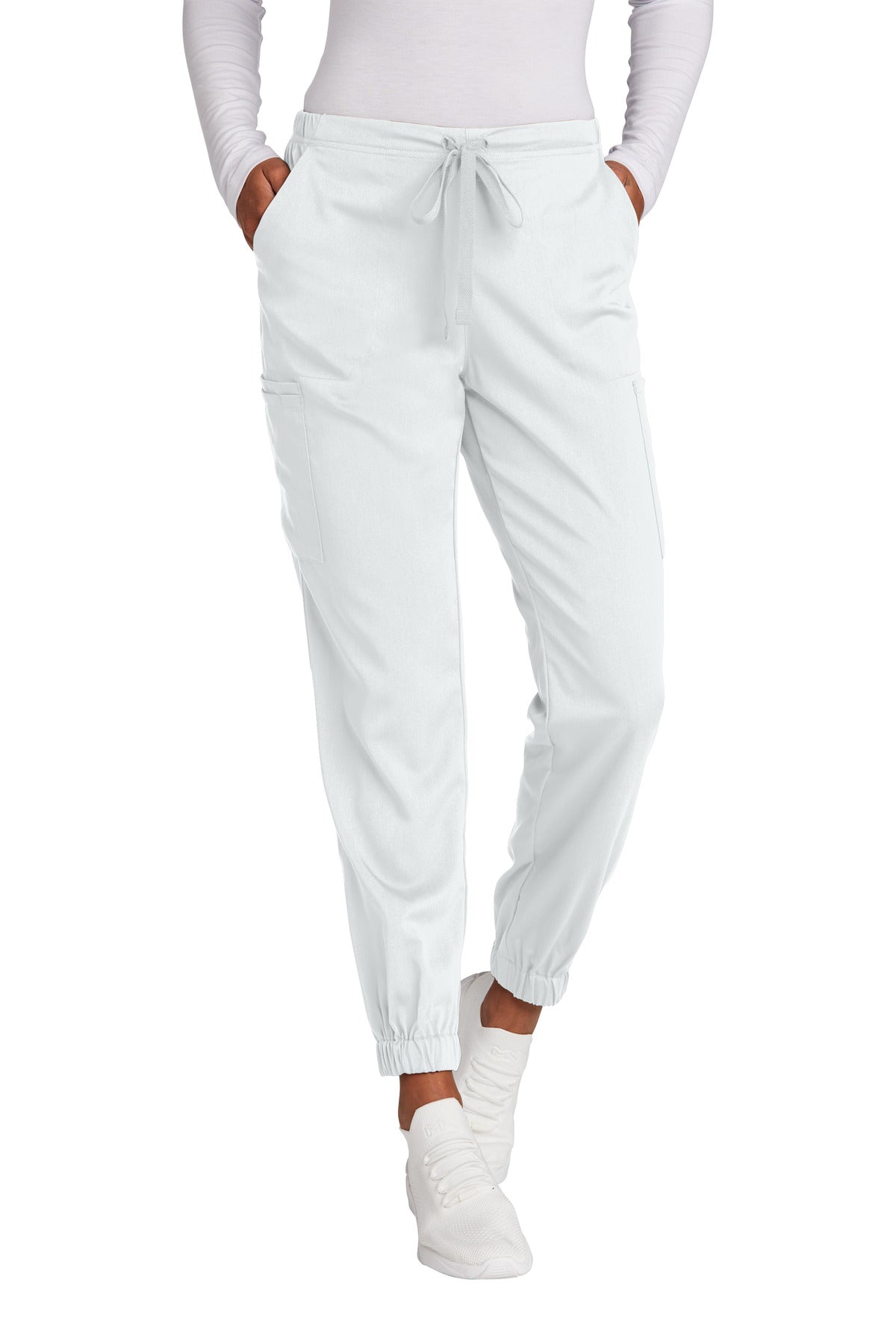 White jogger pants worn by a person on a white background