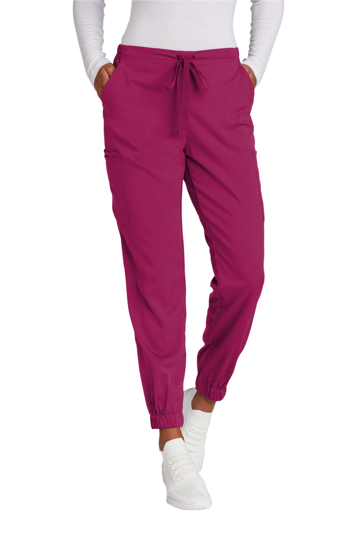 Pink jogger pants worn by a person on a white background